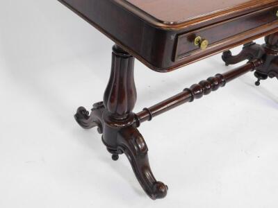 A Victorian mahogany side table, with two frieze drawers raised on turned fluted columns over cabriole legs, on brass casters, united by a turned stretcher 80cm H, 122cm W, 55cm D. - 4