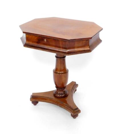 A 19thC Scandinavian mahogany sewing table, the canted rectangular box top with hinged lid opening to reveal a fitted interior, raised on a turned column, over a trefoil base on bun feet, 72cm H, 61.5cm W, 46.5cm D.