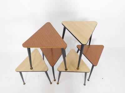 A set of six 1950's triangular occasional tables, with two different coloured laminate tops, raised on turned ebonised legs, brass capped, 37cm W, 41cm D. - 2