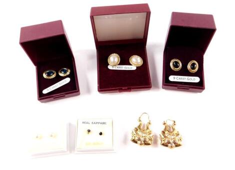 A pair of 9ct gold hollow fancy drop earrings, 4.2g, four pairs of 9ct gold and gem set earrings, and a pair of silver and simulated pearl earrings.