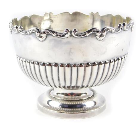 A Victorian silver bowl, of semi fluted and footed form, with a gadrooned rim of rococo scrolls and shells, John Round & Son Ltd, Sheffield 1896, 9.05oz.