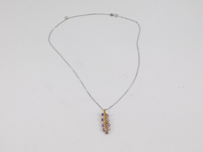 A tanzanite and diamond floral leaf pendant, on a silver neck chain. - 2