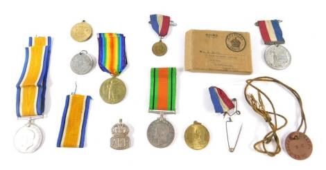 A WWI War and Victory medals, named to Pte II E Smith RAF 129825, together with a WWII Defence medal, ARP badge, dog tag named to E Smith RAMC, 36288., together with Coronation and other commemorative medals. (qty)