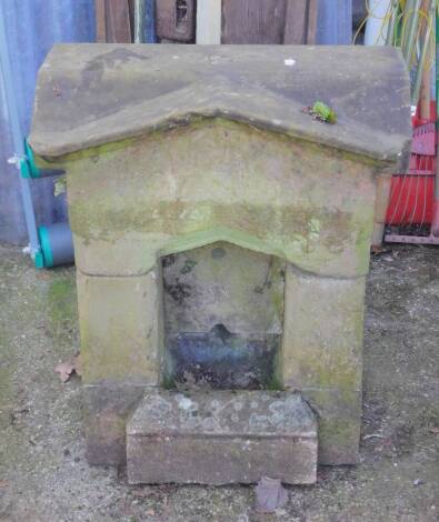 An early 20thC stone dog fountain drinking trough, of temple form, carved above the niche with '1912, In Remembrance of King Edward VII, Lover Of Dogs', 80cm H, 65cm W, 41cm D.