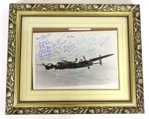 A Derrick Warren photograph of The City of Lincoln Lancaster Bomber, with many signatures including Les Smith, Leonard Cheshire, Bill Reid, Johnnie Johnson, Eve Gibson, Arthur T Harris, David Shannon, Len Sumpter, Ralph Cockrane, Mick Martin, Barnes Walli