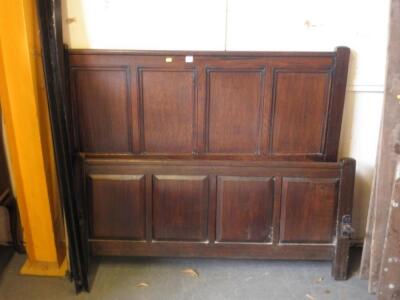 An oak panelled double bed head and foot contructed from old