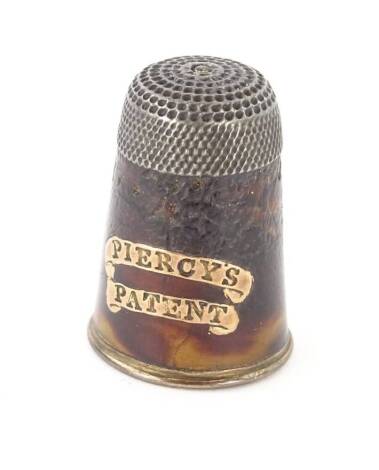 A 19thC Piercy's patent tortoiseshell white and yellow metal thimble, inlaid to one side with name.