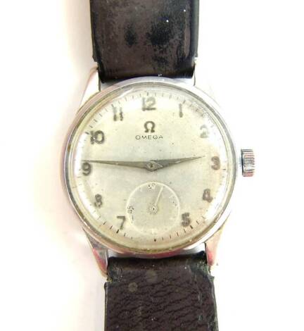 A gentleman's stainless steel Omega wristwatch, with circular silvered coloured dial, with seconds dial (rubbed), on a brown leather strap, the dial 3cm dia.