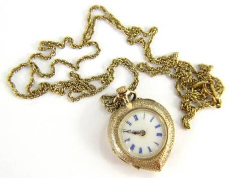 A fob watch, in a heart shaped case, with overall mottled design, with vacant shield to back, and rubbed enamel, yellow metal, stamped 14K, with white enamel dial, on a gold plated chain.