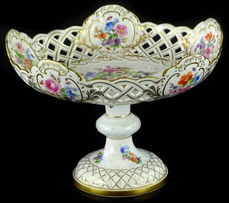 A late Meissen porcelain centrepiece, painted with flower sprays, within a pierced border, on a knopped stem and domed foot, cross swords marked to underside. (AF)