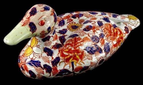 A modern Imari coloured porcelain figure of a duck, oriental marks to underside, 30cm L.