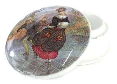 A 19thC Prattware pot lid, printed with a scene of figures ice skating, on a base, 11cm dia.