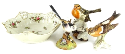 A Goebel ceramic figure of a robin, a Royal Crown Derby long tailed tit, another robin and a Rosenthal pierced bowl, decorated with roses.