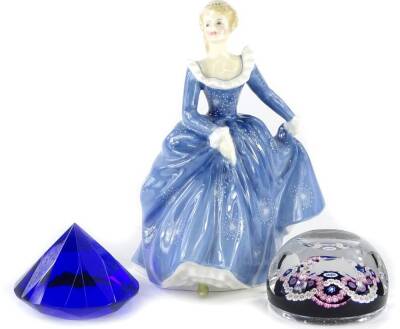 A Whitefriars 1977 silver Jubilee millefiori glass paperweight, numbered to underside 421, a Royal Doulton figurine Fragrance, and a small faceted blue glass Rosenthal paperweight. (3)