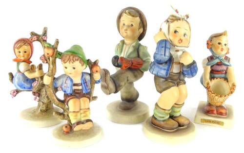 A collection of five Hummel figurines, each modelled in the form of children carrying an umbrella in trees, etc.