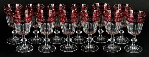 A set of ruby tinted wine glasses, each engraved with leaves, etc. (12)