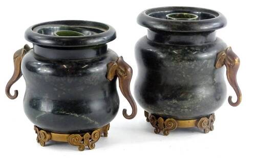 A pair of hardstone vases, with elephant mask handles and cast base, with inserts but missing covers and missing single handle, circa, 15cm H. (AF)