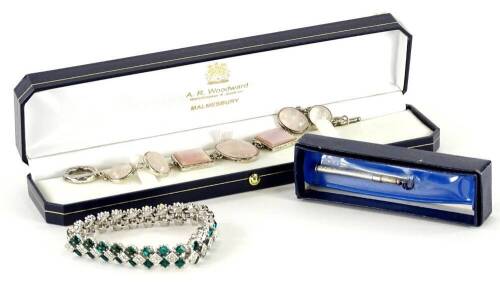 Various modern costume jewellery and effects, to include a paste stone set green and white stone set bracelet, a pink stone set bracelet and a silver pencil case. (3)