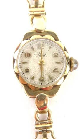 An Avia 9ct gold ladies wristwatch, with small circular dial, with floral design border, on pierced flower design bracelet, 15.1g all in.