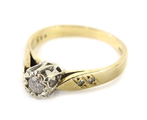 A 9ct gold diamond solitaire ring, with round brilliant cut illusion set diamond, stamped to band 0.15cts, with pierced and raised shoulders, set with two tiny diamonds to each side, ring size M, 2.4g all in.