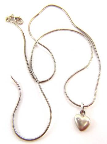 A silver heart shaped pendant and chain, the small heart set with tiny white stone, 1cm W, on a modern chain, boxed.