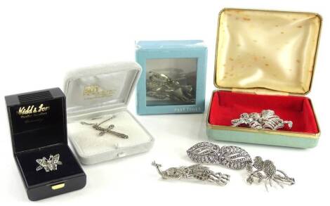 A quantity of silver and silver plated marcasite jewellery, to include a silver plated peacock brooch, a silver two birds on a branch brooch, a white metal two fan brooch stamped 800, a silver plated rose brooch, a silver plated floral basket brooch, a si