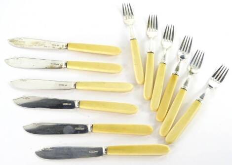 A set of six George V silver plated fish knives and forks, each with a simulated ivory handle, Sheffield 1918.