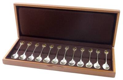 A set of twelve silver RSPB commemorative teaspoons, London 1975, with certificate information r regarding the birds, fitted case and special gloves.