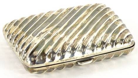 An Edwardian silver cigarette case, with wrythen decoration, Sheffield 1900, 2¾oz.