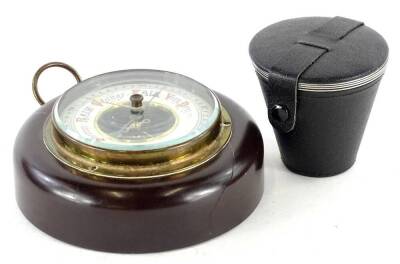 An aneroid barometer in Bakelite case (AF) and a set of stirrup cups.