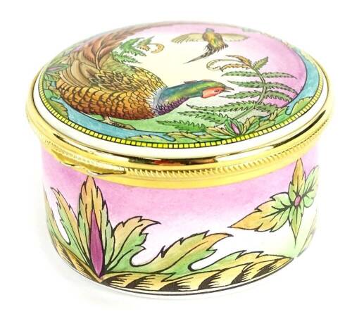 A Moorcroft enamel box, the lid decorated with a pheasant, 6cm dia.