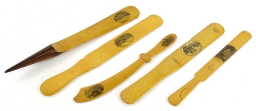 A collection of five Mauchlineware sycamore paper knives and page turners.