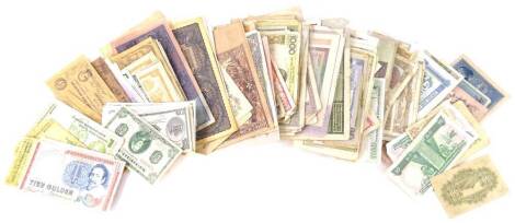 A large quantity of used World banknotes.