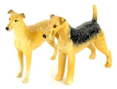 A Beswick pottery greyhound champion, Jovial Roger and an Airedale Terrier champion, cast iron monarch. (2)