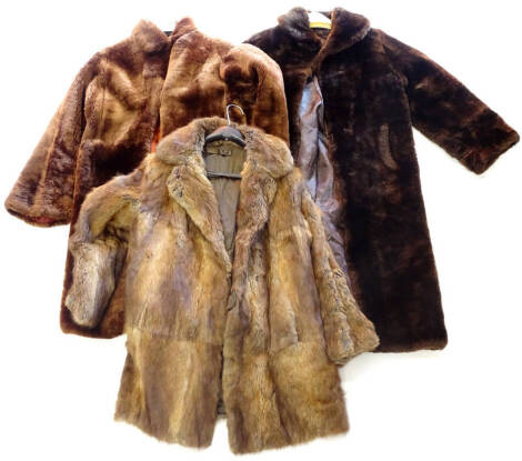 Two fake fur coats and a fur coat possibly rabbit.