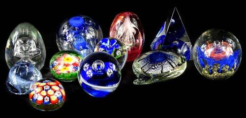 A collection of coloured paperweights, various styles and designs, all unmarked.