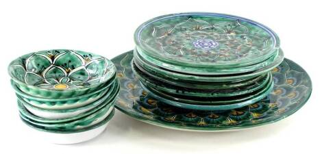 A collection of continental tin glazed table ware, to include a large platter, dinner plates, bowls, etc.