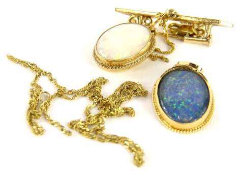 Various opal jewellery, to include a 9ct gold pale opal brooch, 3cm H, and a 9kt gold blue imitation opal pendant, on fine link chain, (AF-clasp broken), 7.2g all in.