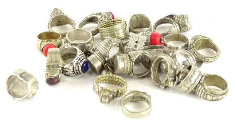 Various silver and other dress rings, comprising mainly Eastern dress rings, unmarked, of varying design. (a quantity)