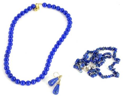 Three items of modern lapis jewellery, comprising a pair of earrings, with yellow metal mounts, marked 9K, a Lee Sands necklace, with gold plated clasp and another with silver clasp. (3)