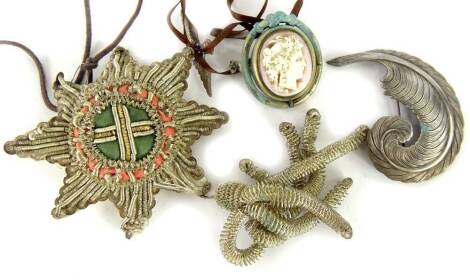 A collection of items, to include a silver and enamel RAF brooch, cameo brooch, white coloured metal feather brooch and a pendant made with metal thread. (4)