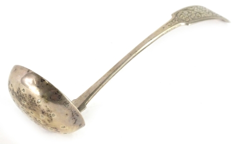 An early 19thC Scottish provincial fiddle pattern toddy ladle, engraved with scrolls, makers stamp R & RK, hallmarked for Perth.