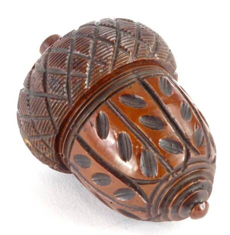 A 19thC carved Coquilla nutmeg grater, in the form of an acorn.