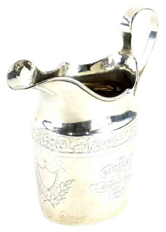 A 19thC silver plain helmet shaped cream jug, with band of shells and leaves, vacant cartouche to end, engraved centrally for the 12th Lincolnshire North Regiment won by Corporal Porter 1863 3¼oz.