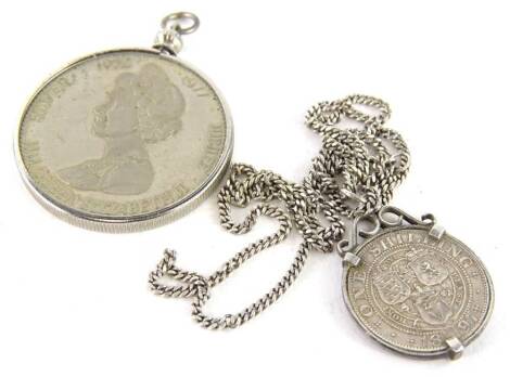 Two items of silver coin jewellery, comprising an 1897 Victoria shilling, in silver mount, on silver curb link chain, and a Queen Elizabeth II 1952-1977 silver jubilee coin pendant, in silver plated frame. (2)