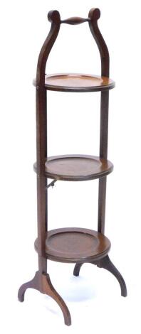 An Edwardian mahogany three tier cake stand, 89cm H.