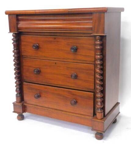 A Victorian mahogany chest of drawers, the top with a moulded edge above a cushion shaped drawer, and three further drawers, each with turned handles flanked by spirally turned pillars, on bun feet, 112cm W.