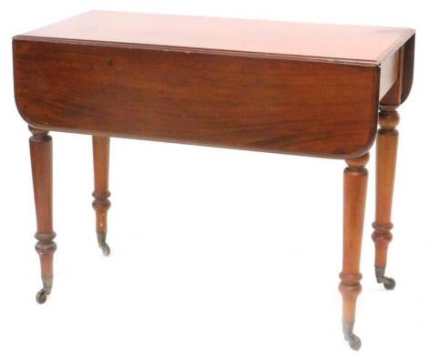 A Victorian mahogany Pembroke table, the rectangular top with rounded corners on turned tapering legs with brass castors, 90cm W.