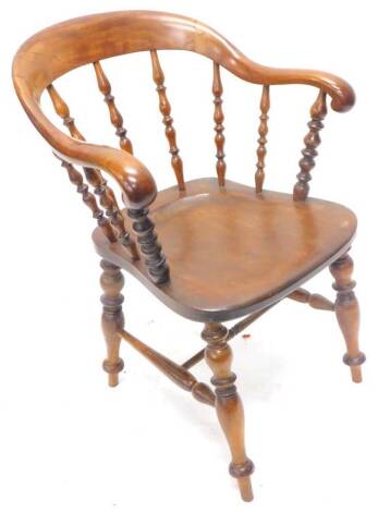 A 19thC ash, birch and elm captains type chair, the shaped back with turned supports, solid seat on turned legs with H stretcher. (AF)