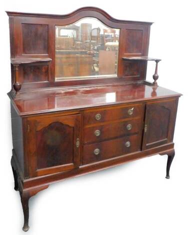 An early 20thC mahogany mirror back sideboard, the raised back with a bevelled plate flanked by two shelves, each with turned supports, the base with a moulded edge, above three drawers and two panel doors, on cabriole legs with pad feet, 153cm W.